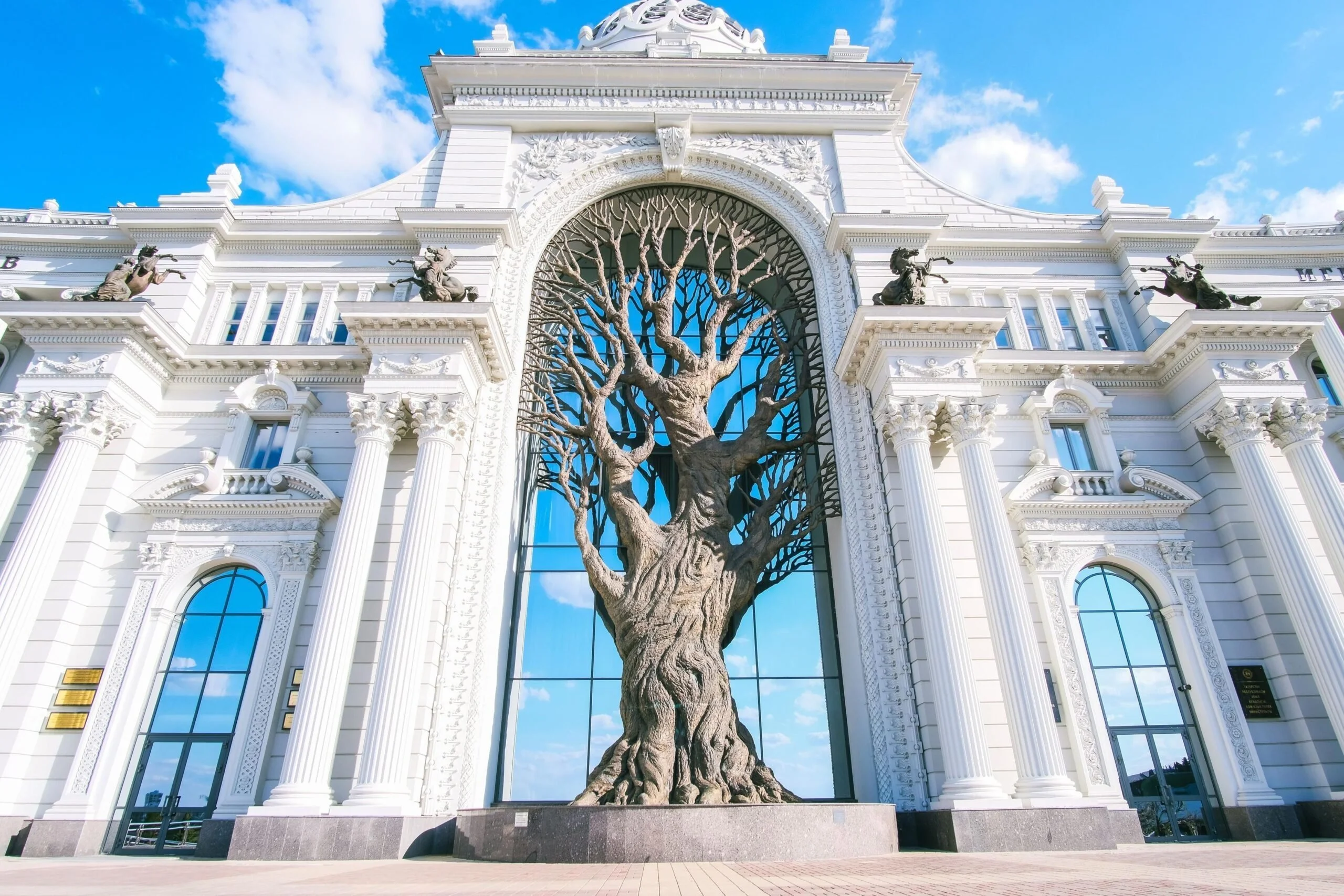 Farmer's Palace in Kazan; enormous, beautiful building with a large tree growing in the central portcullis